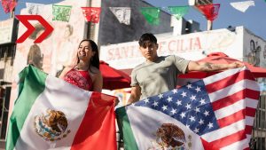 La presidenta Claudia Sheinbaum se dirige a la comunidad mexicana en el extranjero durante un evento.