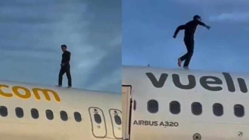 Elementos de la Guardia Civil custodian la aeronave de Vueling tras el descenso del hombre que escaló el fuselaje.