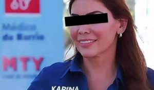 Elementos de la Agencia Estatal de Investigaciones custodian el traslado de la funcionaria municipal tras su detención este lunes.